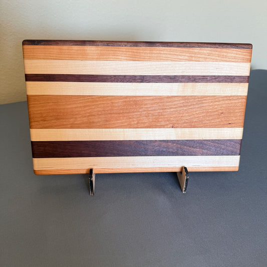 Solid hardwood chopping with random stripes of varied colored hardwood seen standing on edge. Measures 8 x 13.